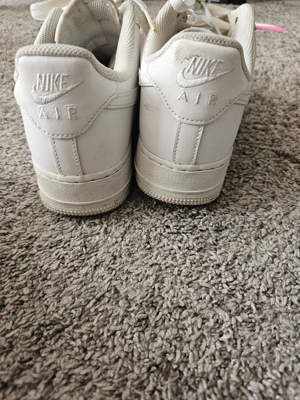 Nike White Low-Top Sneakers with Subtle Black Swoosh